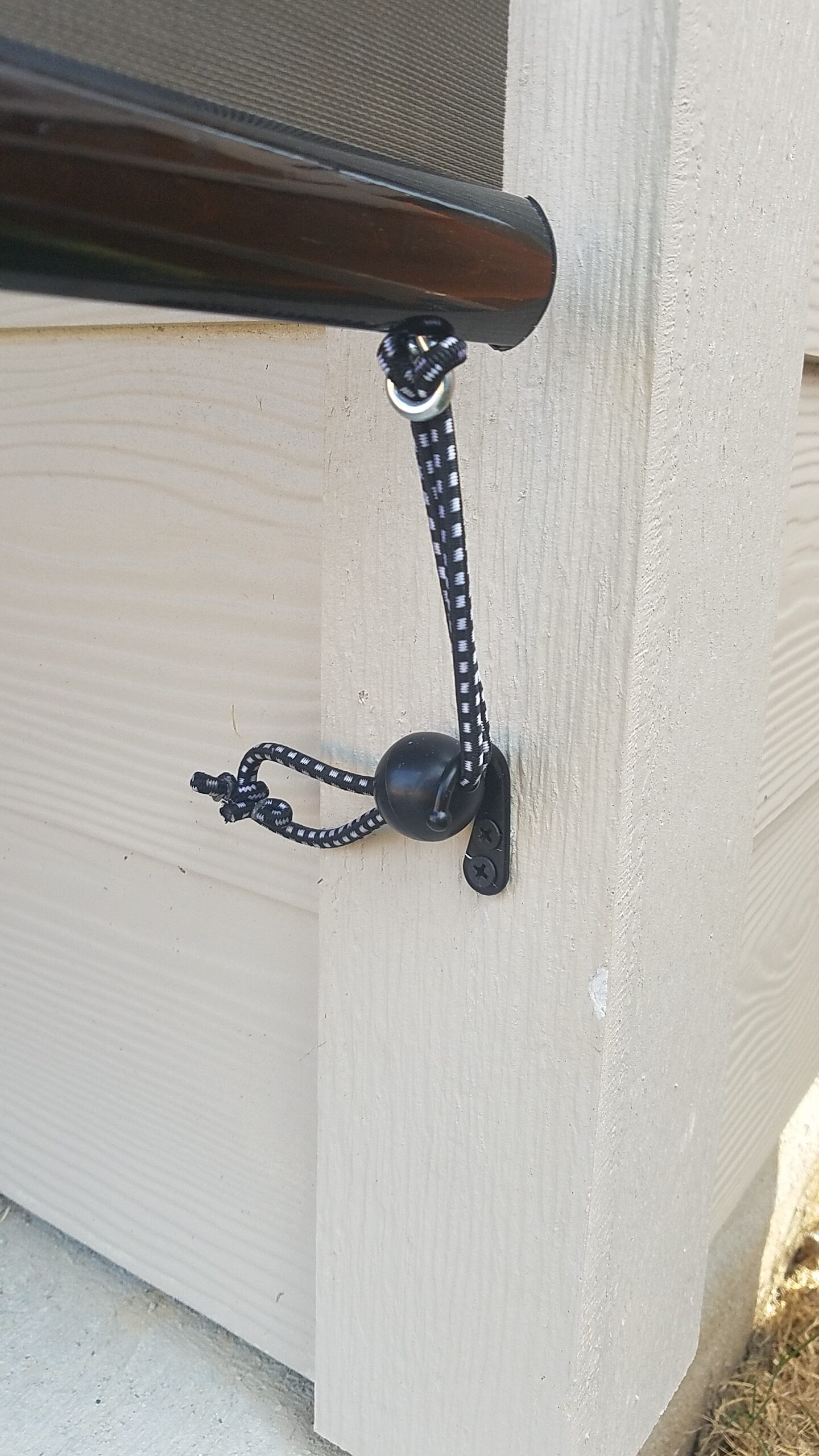 Metal hook for roll up patio blinds tie down.
