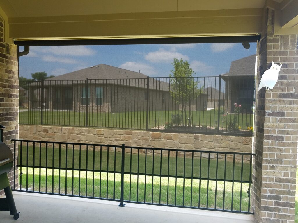 Looking through Austin Texas outdoor roller blinds.