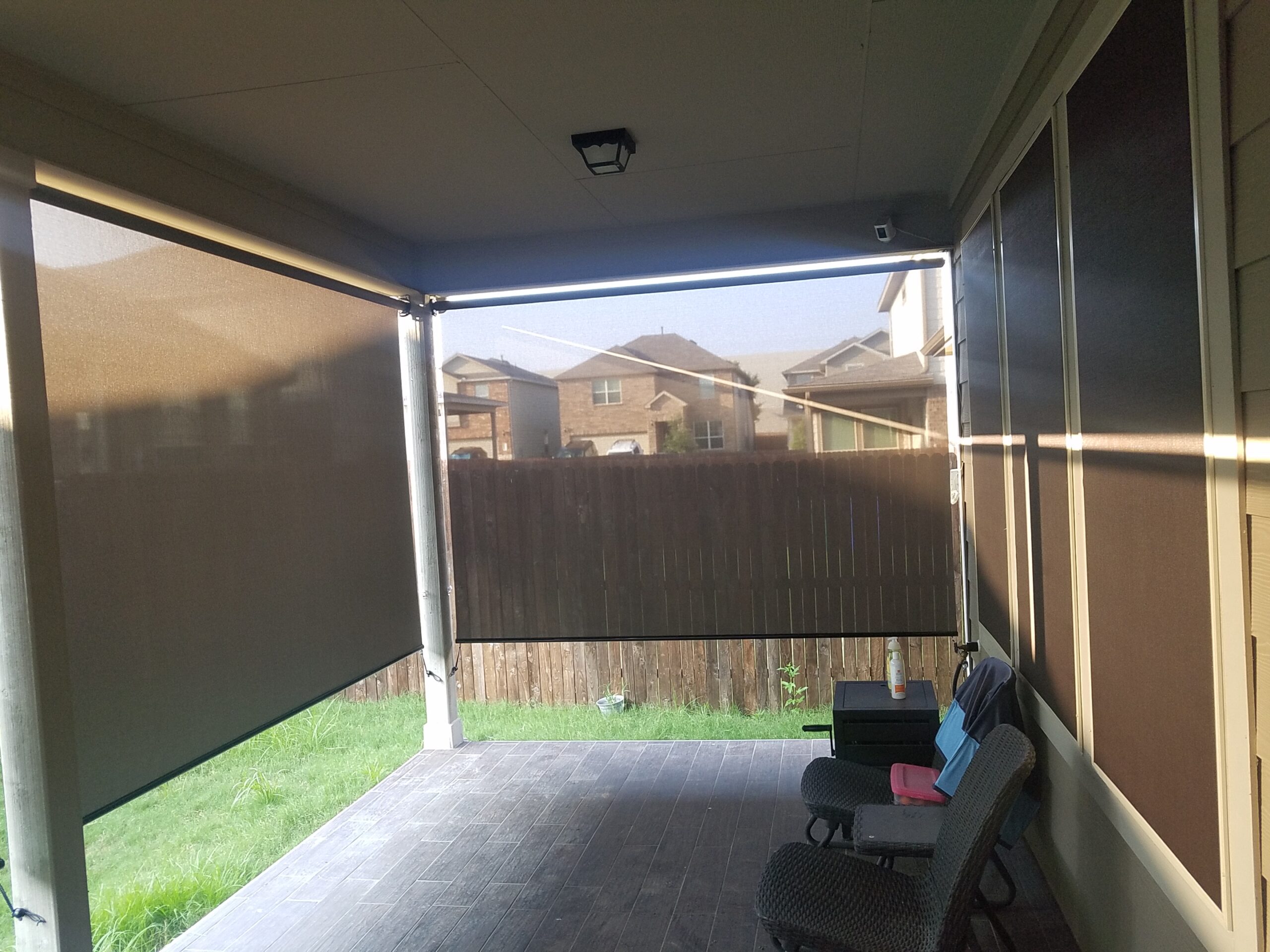 Mocha solar screens and New Brown roller shades