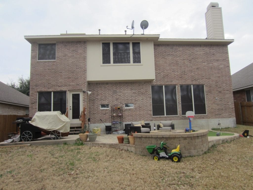 Back of Round Rock Home with eleven solar screens.  Made out for 80% solar window screen fabric.